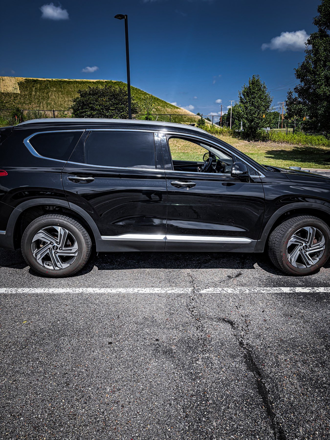 Side view of the black Hyundai Santa Fe SUV